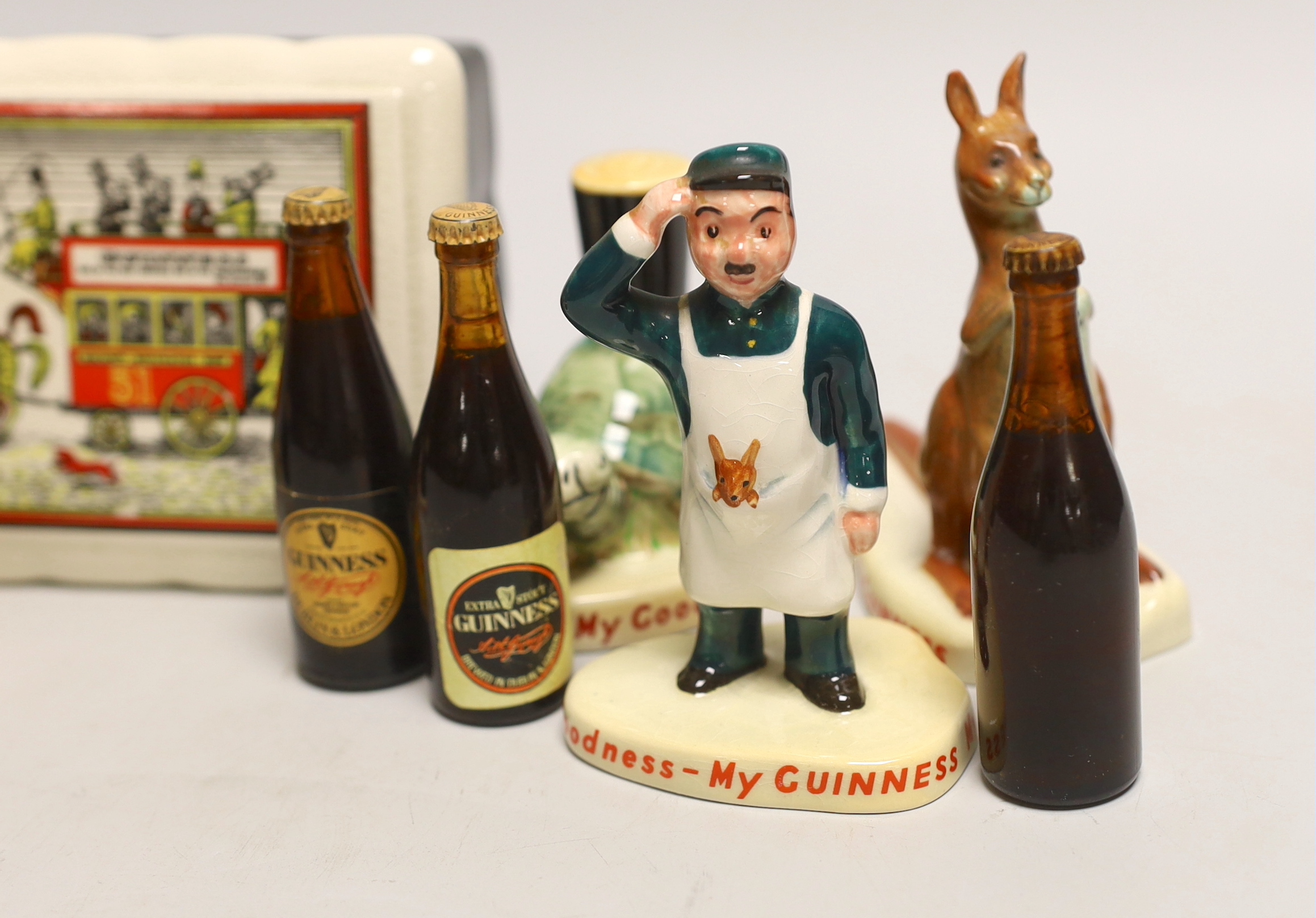 Six Carltonware Guinness advertising models, three related bottles and a rectangular box